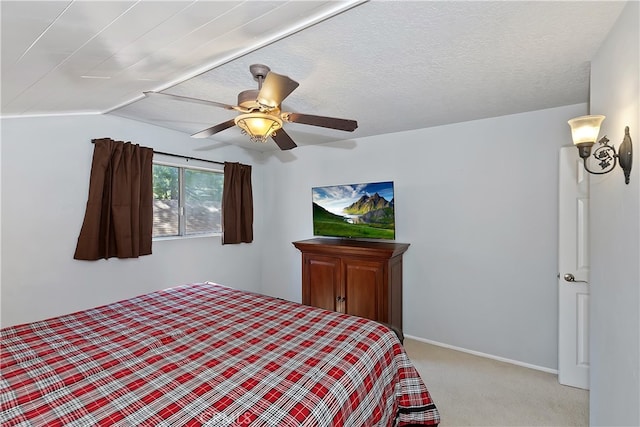 279 Bluebird Ct, Big Bear Lake, CA 92315 - bedroom with light carpet, a textured ceiling, baseboards, and ceiling fan