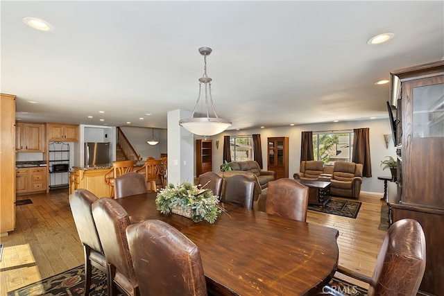 279 Bluebird Ct, Big Bear Lake, CA 92315 - dining area with stairs, light wood-style floors, and recessed lighting