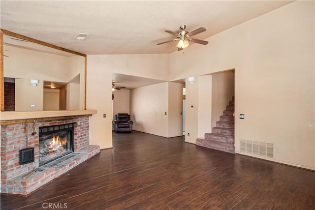 14935 Elizabeth Lake Rd, Lake Elizabeth, CA 93532 - unfurnished living room featuring lofted ceiling, a fireplace, visible vents, and a ceiling fan