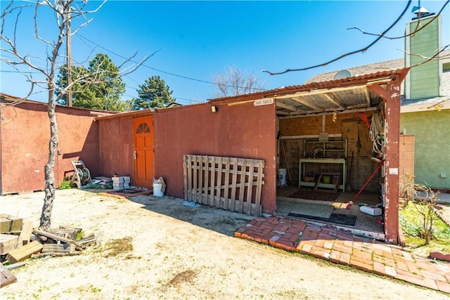 14935 Elizabeth Lake Rd, Lake Elizabeth, CA 93532 - exterior space featuring stucco siding, an outbuilding, and a garage