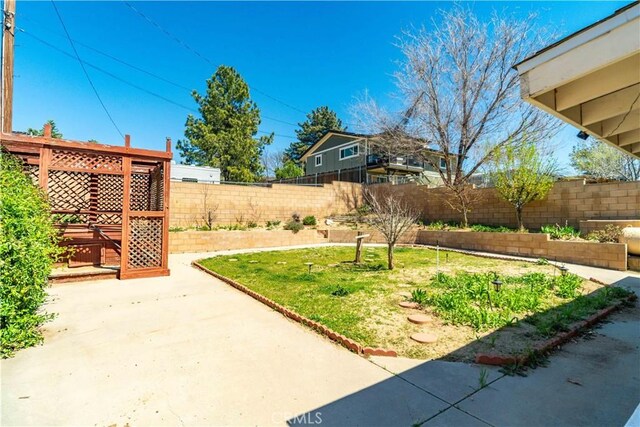 14935 Elizabeth Lake Rd, Lake Elizabeth, CA 93532 - view of yard featuring a garden, a fenced backyard, and a patio
