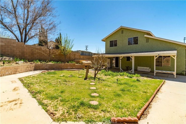 14935 Elizabeth Lake Rd, Lake Elizabeth, CA 93532 - view of front of house with a front lawn, stucco siding, a porch, and fence
