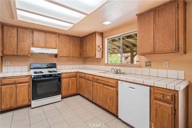 14935 Elizabeth Lake Rd, Lake Elizabeth, CA 93532 - kitchen featuring white appliances, brown cabinetry, under cabinet range hood, and a sink