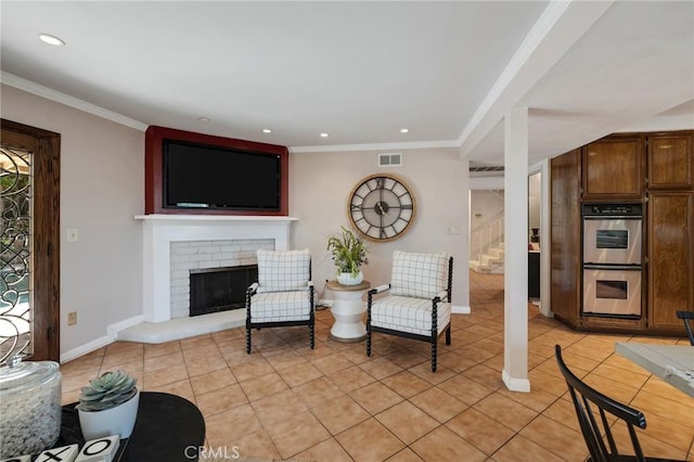 living room with light tile patterned floors, stairway, visible vents, and a fireplace