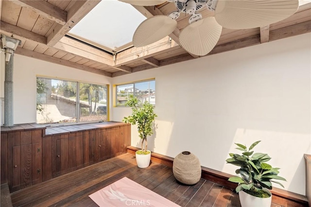 exterior space featuring beamed ceiling and a wealth of natural light