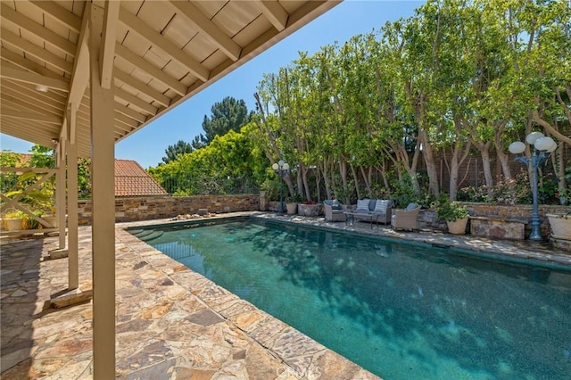 view of pool with a patio area and a fenced in pool