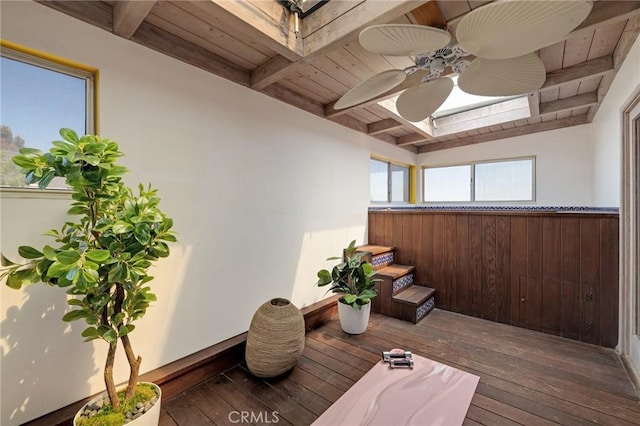wooden terrace featuring a ceiling fan