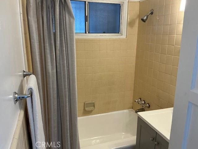 bathroom with shower / bath combo and vanity