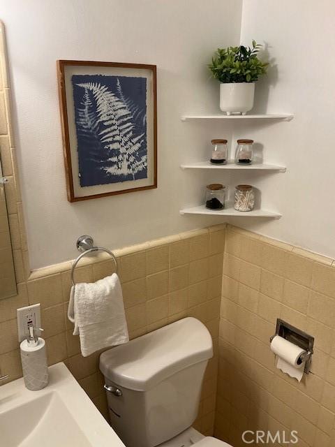 4522 W 156th St, Lawndale, CA 90260 - half bath with tile walls, toilet, and wainscoting