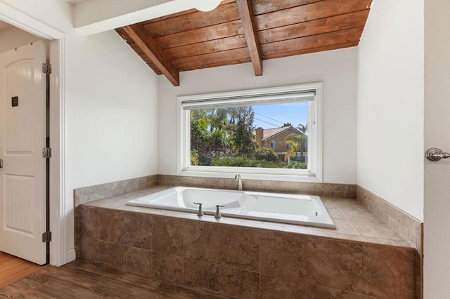 full bathroom featuring lofted ceiling with beams, wood finished floors, wooden ceiling, and a garden tub