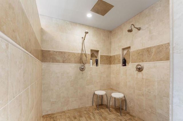 bathroom with tiled shower
