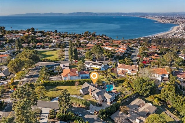 birds eye view of property featuring a water and mountain view and a residential view
