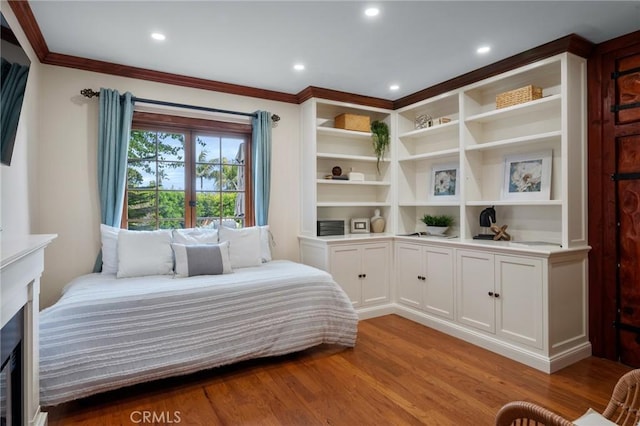bedroom featuring recessed lighting, ornamental molding, and light wood finished floors