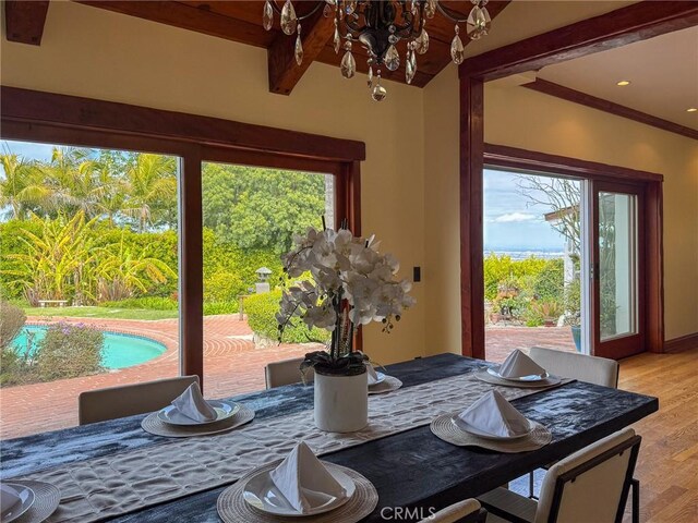 2501 Novato Pl, Palos Verdes Estates, CA 90274 - dining space with a chandelier, light wood finished floors, and beam ceiling