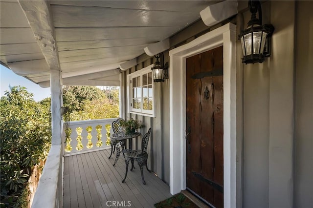 entrance to property featuring a porch