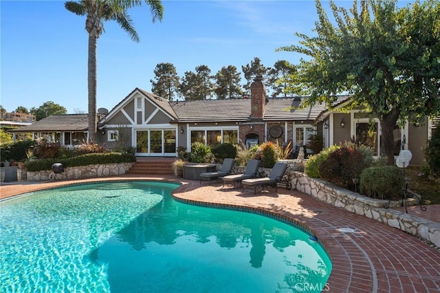 pool with a patio