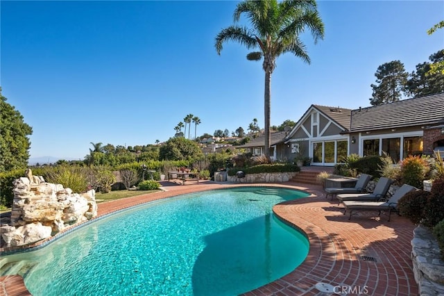 pool with a patio area
