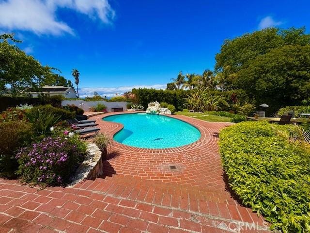 outdoor pool featuring a patio area