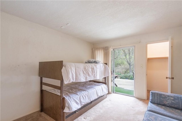 3332 Harbor Cir Unit C, Paso Robles, CA 93446 - carpeted bedroom featuring access to exterior and a textured ceiling