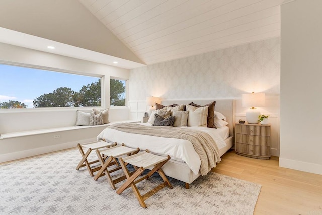 bedroom featuring baseboards, light wood-type flooring, recessed lighting, wallpapered walls, and lofted ceiling