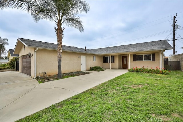 ranch-style house with a garage, fence, stucco siding, a front lawn, and driveway