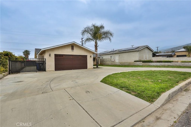 single story home with concrete driveway, stucco siding, fence, and an attached garage