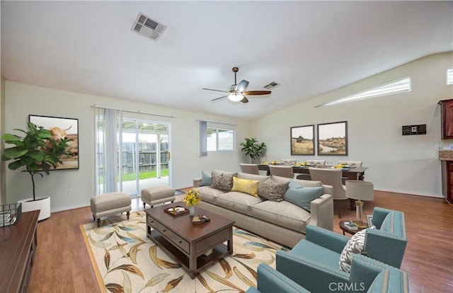 5420 Chiquita Ln, San Bernardino, CA 92404 - living area with lofted ceiling, wood finished floors, and ceiling fan