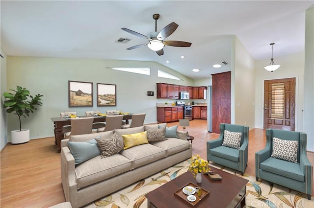 5420 Chiquita Ln, San Bernardino, CA 92404 - living room with lofted ceiling, ceiling fan, and light wood-style flooring