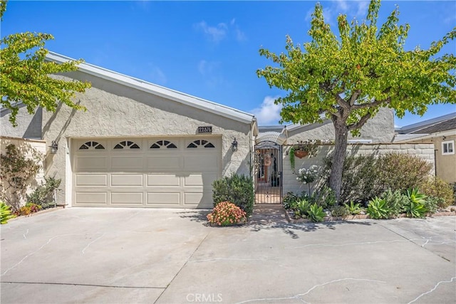 22876 Montalvo Rd, Laguna Niguel, CA 92677 - ranch-style home featuring concrete driveway, an attached garage, and stucco siding