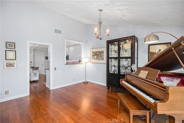 22876 Montalvo Rd, Laguna Niguel, CA 92677 - sitting room with a chandelier, lofted ceiling, wood finished floors, and baseboards