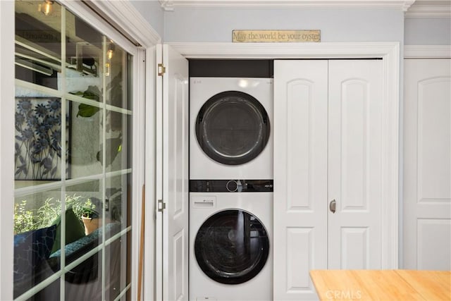 22876 Montalvo Rd, Laguna Niguel, CA 92677 - laundry room with stacked washer / dryer and ornamental molding