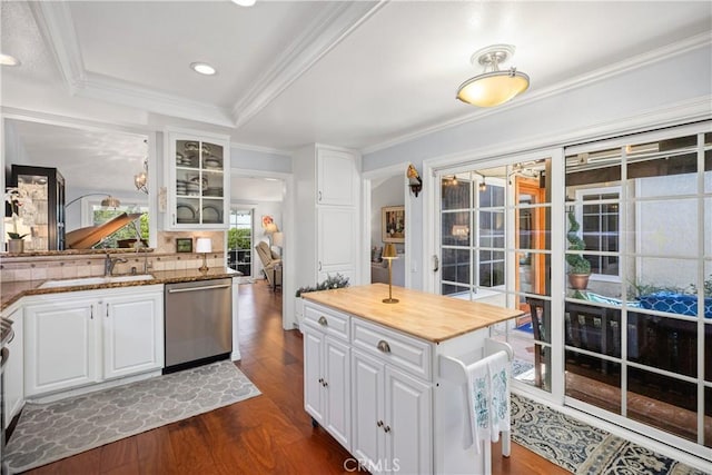 22876 Montalvo Rd, Laguna Niguel, CA 92677 - kitchen featuring dishwasher, a sink, dark wood-style floors, white cabinetry, and glass insert cabinets