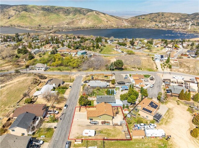 bird's eye view with a residential view and a water and mountain view