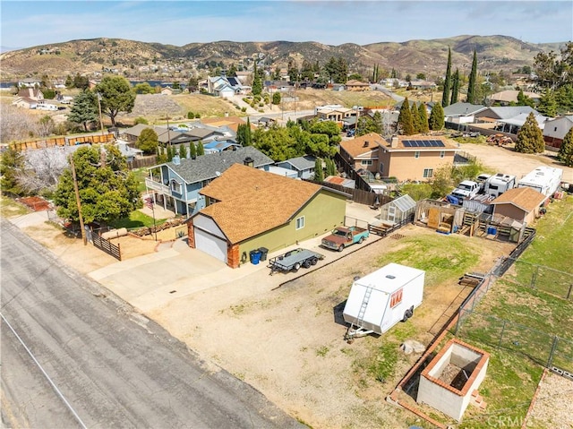 drone / aerial view with a residential view and a mountain view