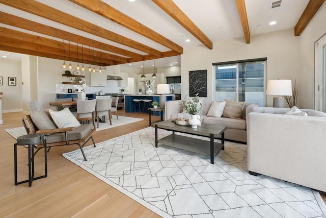 2264 Soto St, San Diego, CA 92107 - living room with beam ceiling and light wood finished floors