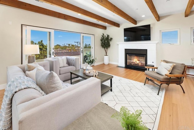 2264 Soto St, San Diego, CA 92107 - living room featuring light wood finished floors, a fireplace with flush hearth, beamed ceiling, baseboards, and recessed lighting