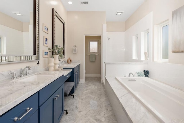 2264 Soto St, San Diego, CA 92107 - bathroom with vanity, a bath, baseboards, tiled shower, and marble finish flooring
