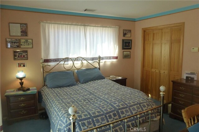 bedroom with a closet and visible vents