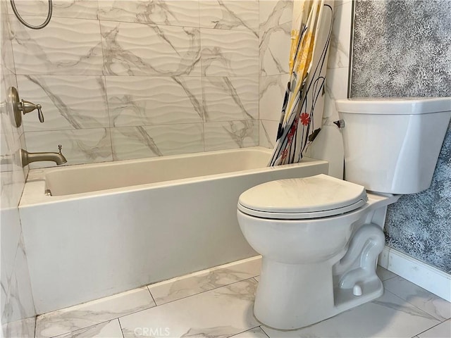 bathroom featuring marble finish floor, shower / tub combo, toilet, and baseboards