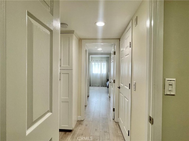 corridor with light wood-style flooring