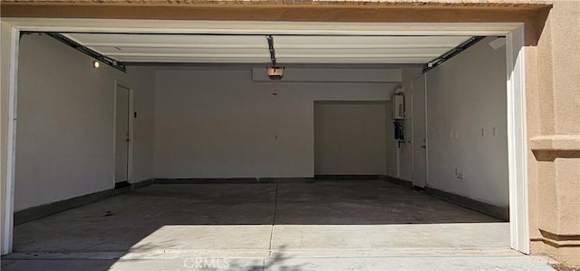 5232 Las Palmas Way, Chino, CA 91710 - garage featuring a garage door opener and baseboards