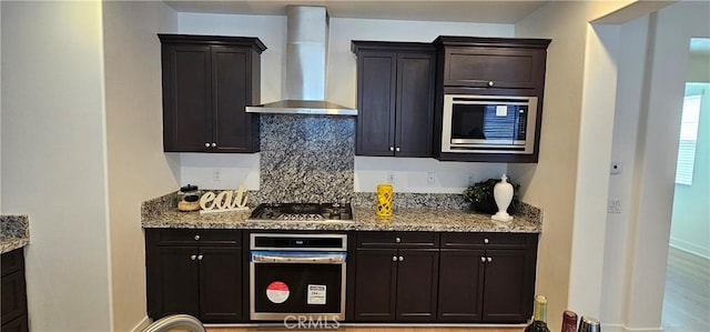 5232 Las Palmas Way, Chino, CA 91710 - kitchen with wall chimney exhaust hood, appliances with stainless steel finishes, backsplash, light stone counters, and baseboards