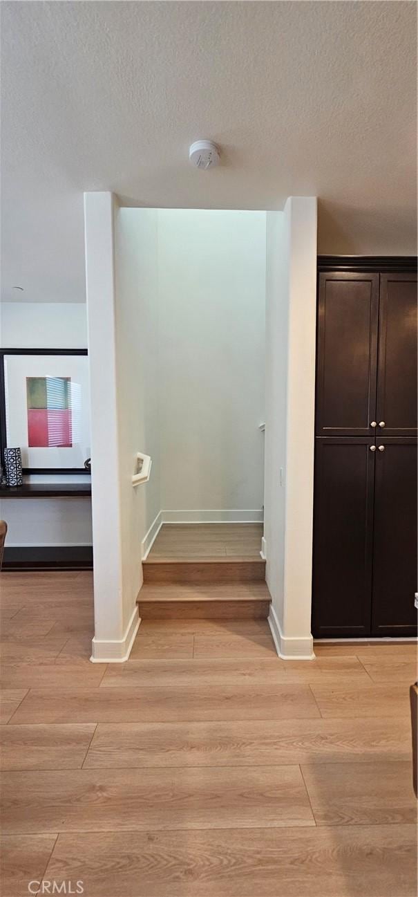 5232 Las Palmas Way, Chino, CA 91710 - stairs with wood finished floors, baseboards, and a textured ceiling