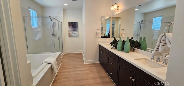 5232 Las Palmas Way, Chino, CA 91710 - full bath with a stall shower, double vanity, wood finished floors, a bath, and plenty of natural light