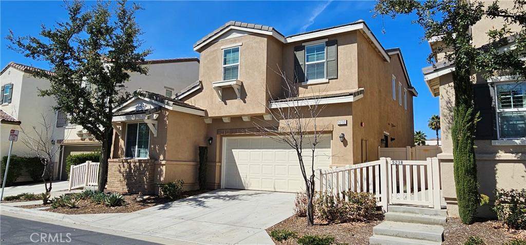5232 Las Palmas Way, Chino, CA 91710 - view of property featuring stucco siding, an attached garage, and concrete driveway