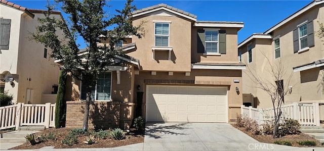 5232 Las Palmas Way, Chino, CA 91710 - view of front facade featuring stucco siding, driveway, a tiled roof, and a garage