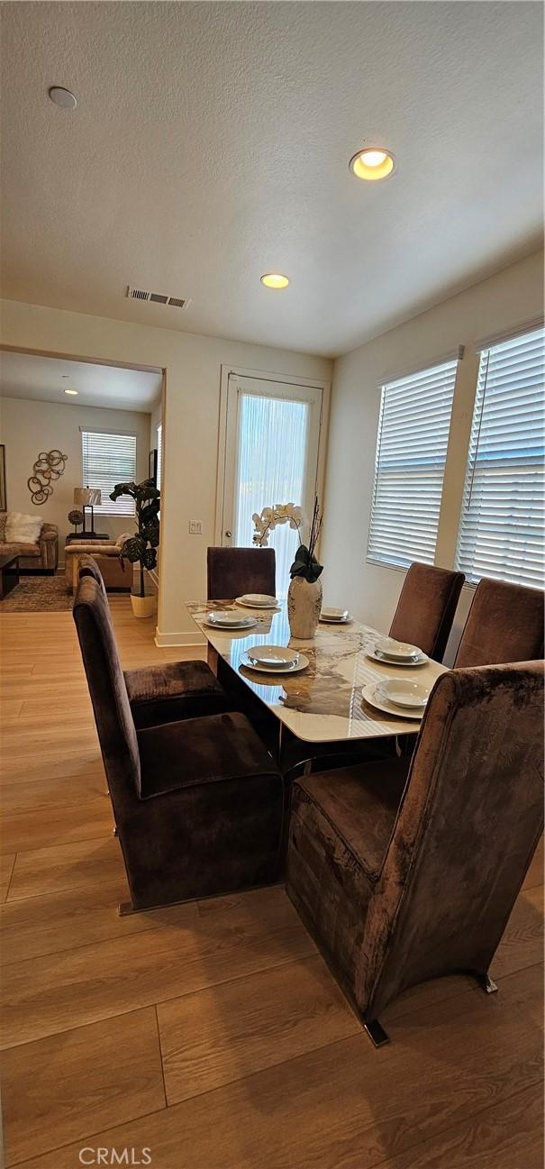 5232 Las Palmas Way, Chino, CA 91710 - dining space with wood finished floors, healthy amount of natural light, recessed lighting, and a textured ceiling