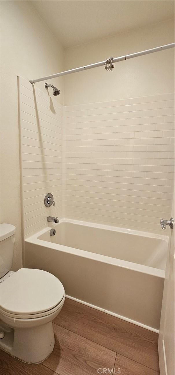 5232 Las Palmas Way, Chino, CA 91710 - bathroom with wood finished floors, toilet, and bathtub / shower combination