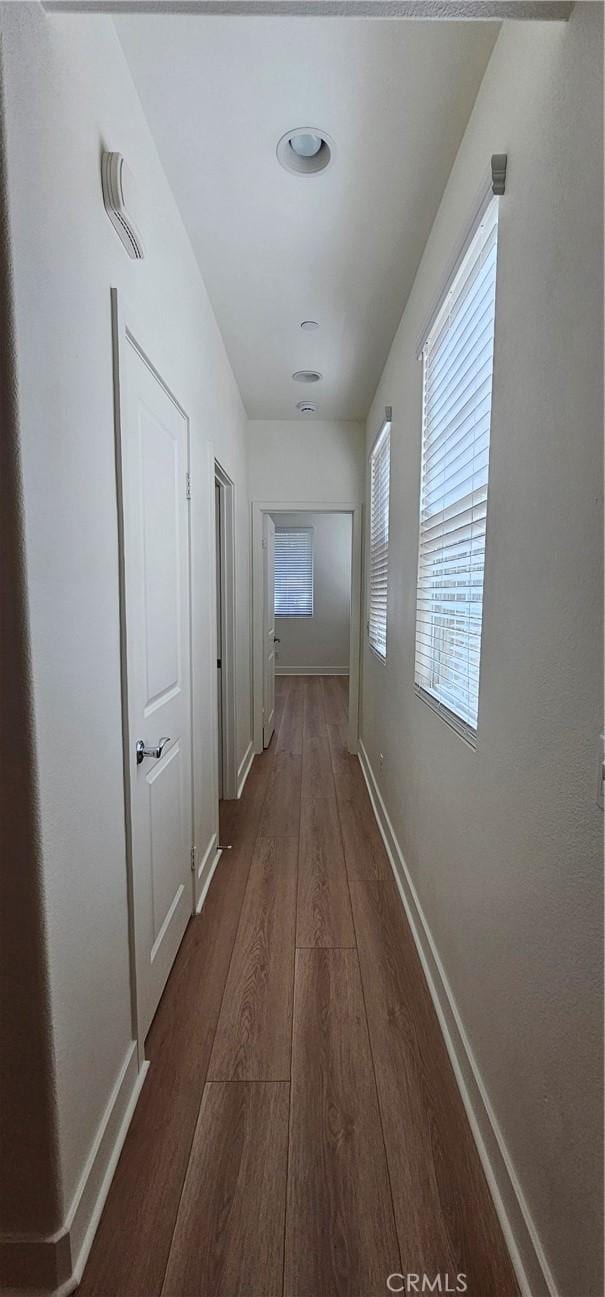 5232 Las Palmas Way, Chino, CA 91710 - hallway featuring dark wood-type flooring and baseboards