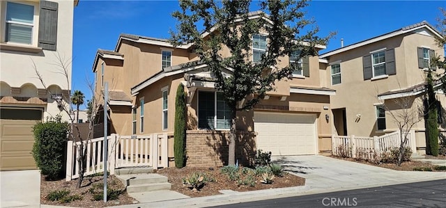 5232 Las Palmas Way, Chino, CA 91710 - view of property featuring stucco siding, an attached garage, and driveway